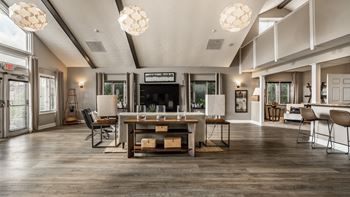 A modern living room with a wooden floor and a fireplace